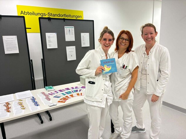 Foto: Gesundheit Burgenland Drei Personen an einem Stand zum Thema Gesundheitsvorsorge